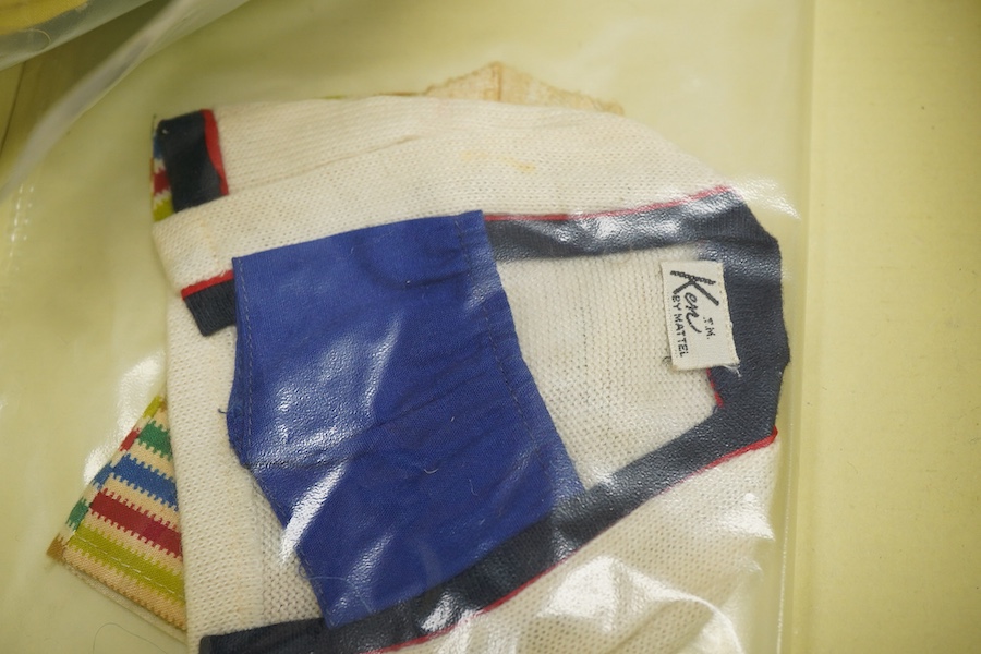 A 1960's Mattel Inc. Barbie doll, 1963, together with a Skipper doll, and a collection of eight original outfits with accessories, sorted into individual packets, outfits purchased between 1963 to 1966 include; American